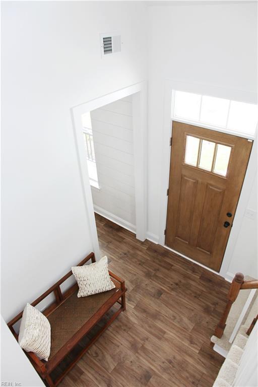 foyer entrance with dark hardwood / wood-style floors