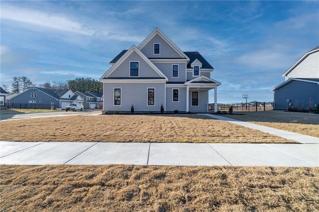 craftsman-style house featuring a front yard