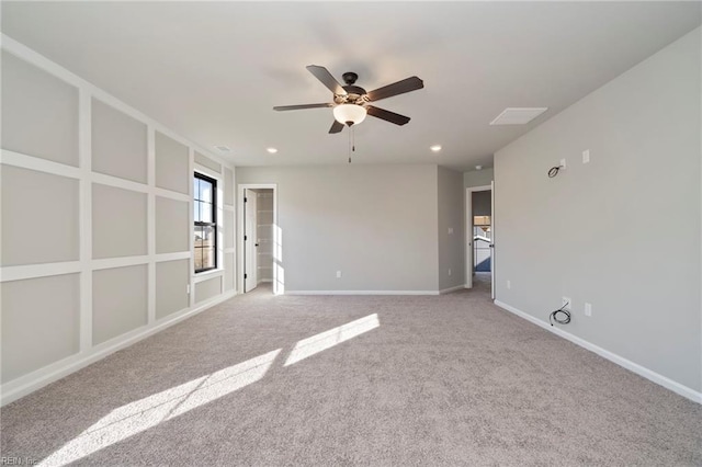 carpeted spare room with ceiling fan