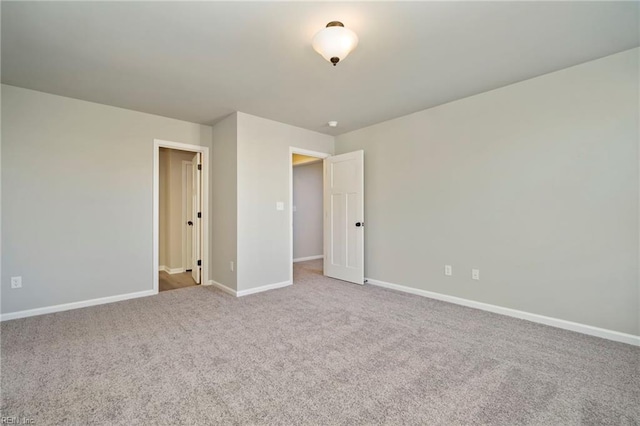 unfurnished room featuring carpet flooring