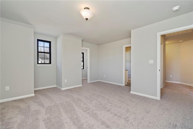 unfurnished bedroom with light colored carpet