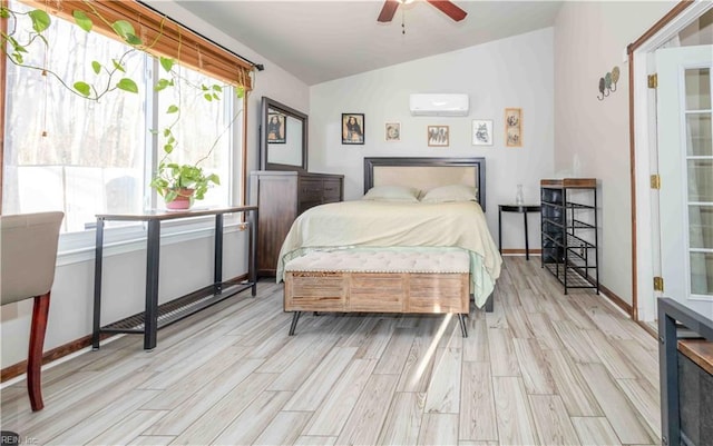 bedroom featuring ceiling fan, a wall mounted air conditioner, vaulted ceiling, and light wood-type flooring