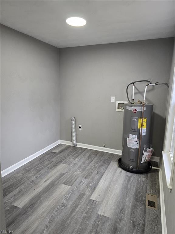 utility room featuring electric water heater