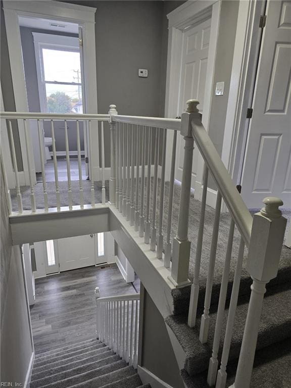 staircase featuring hardwood / wood-style floors