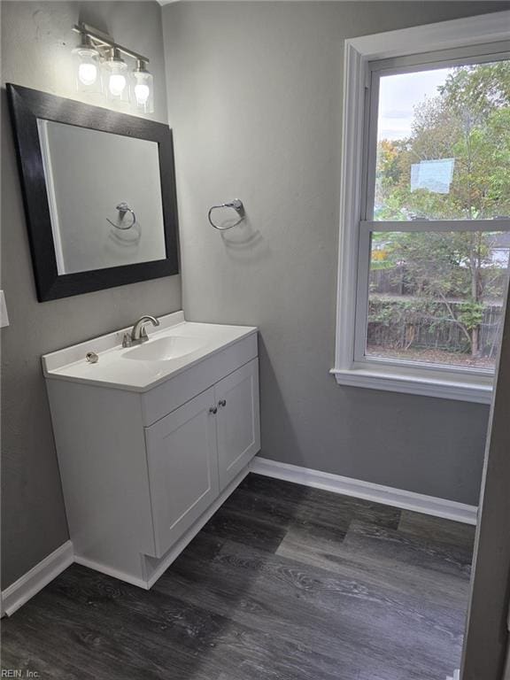 bathroom with hardwood / wood-style floors and vanity