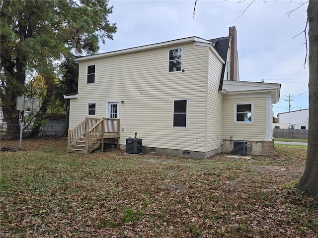 rear view of house featuring cooling unit