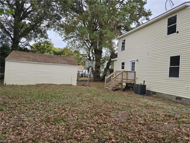 view of yard featuring central air condition unit and a shed