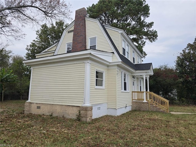 view of property exterior featuring a yard