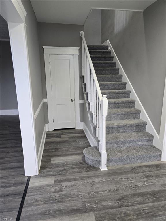 stairway featuring hardwood / wood-style floors