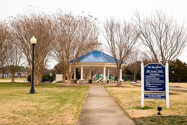 view of property's community with a gazebo and a lawn