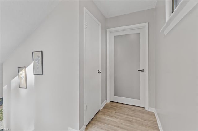 corridor with light wood-type flooring