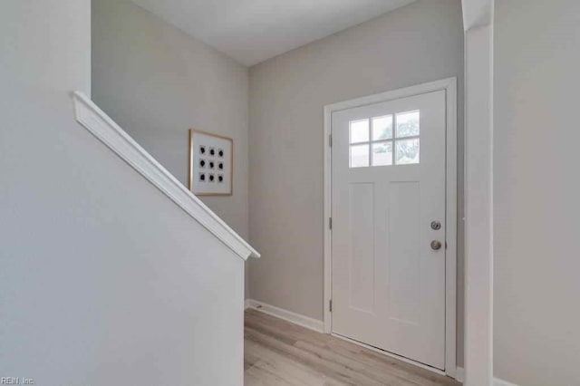 entryway with light hardwood / wood-style floors