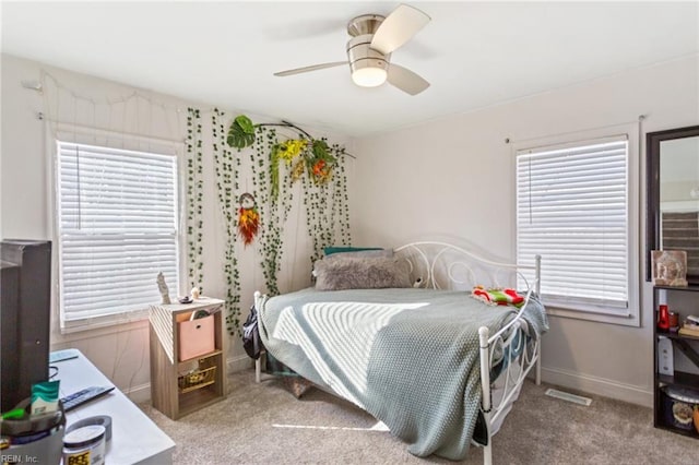 carpeted bedroom with ceiling fan