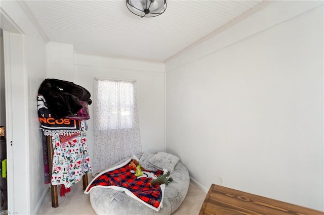 carpeted bedroom featuring ornamental molding