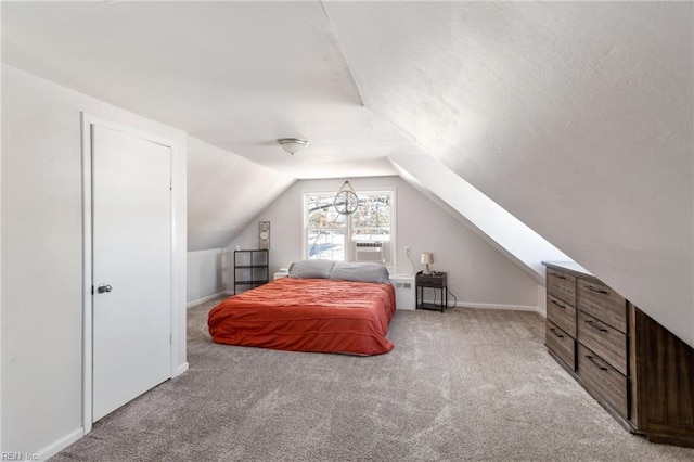 carpeted bedroom featuring vaulted ceiling