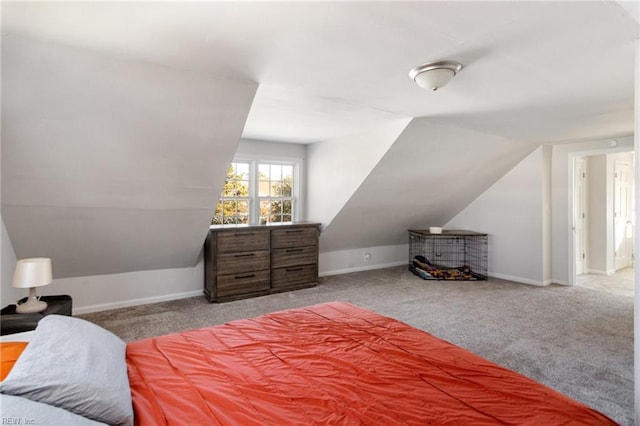 bedroom with carpet flooring and vaulted ceiling