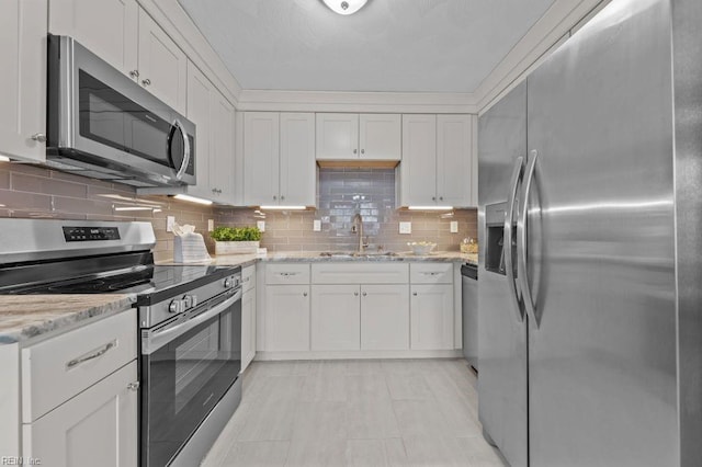 kitchen with sink, white cabinetry, and stainless steel appliances