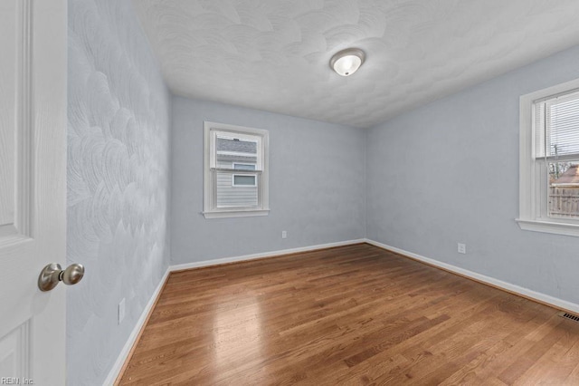 unfurnished room featuring wood-type flooring