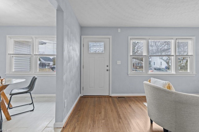 foyer entrance featuring light hardwood / wood-style flooring