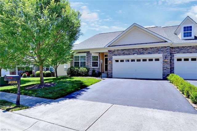 view of front of property featuring a garage and a front yard