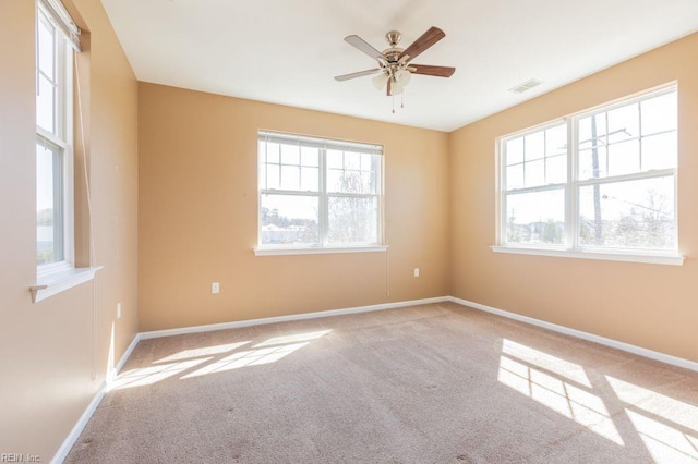 carpeted empty room with ceiling fan