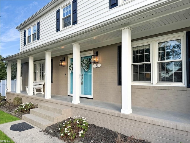 property entrance with covered porch