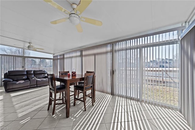 sunroom / solarium featuring ceiling fan