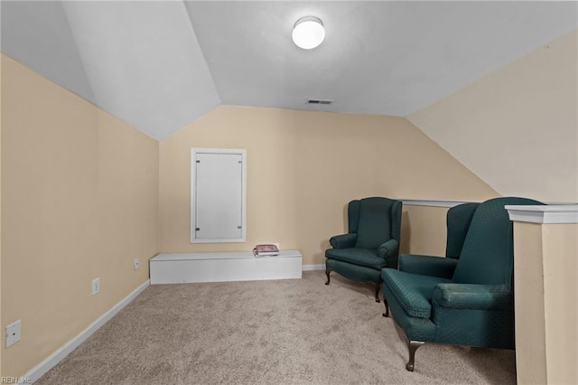 living area with carpet flooring and lofted ceiling