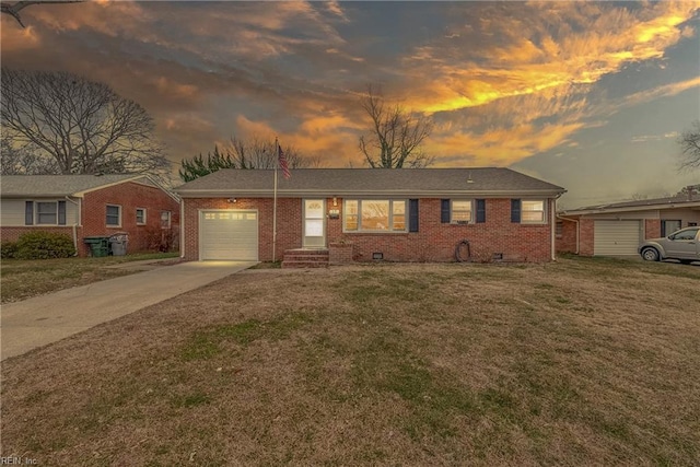 single story home with a lawn and a garage