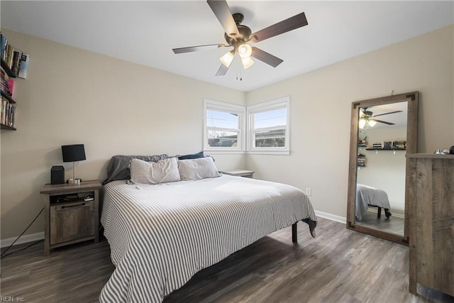 bedroom featuring dark hardwood / wood-style floors and ceiling fan