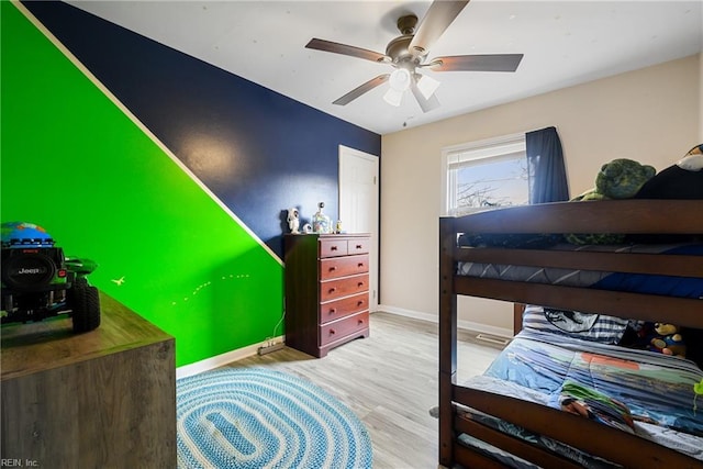 bedroom featuring light hardwood / wood-style floors and ceiling fan