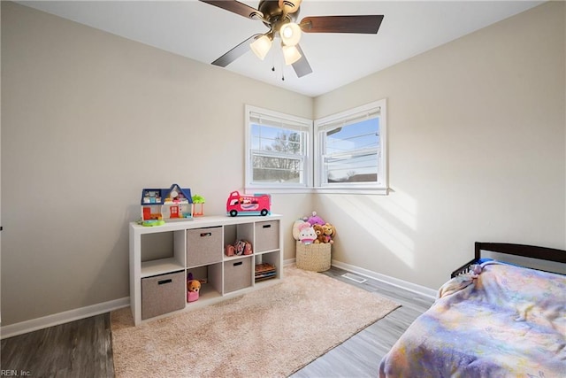 bedroom featuring light wood-type flooring and ceiling fan