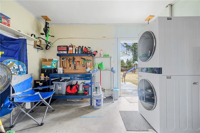 laundry area featuring stacked washer and dryer