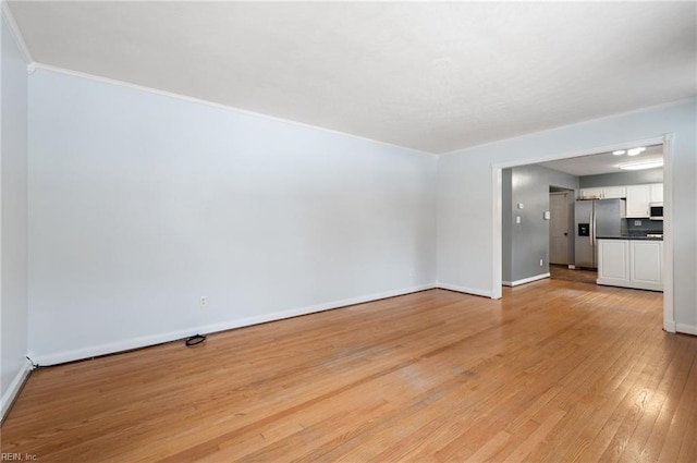 unfurnished living room featuring light wood-type flooring