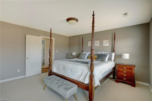 bedroom with light colored carpet