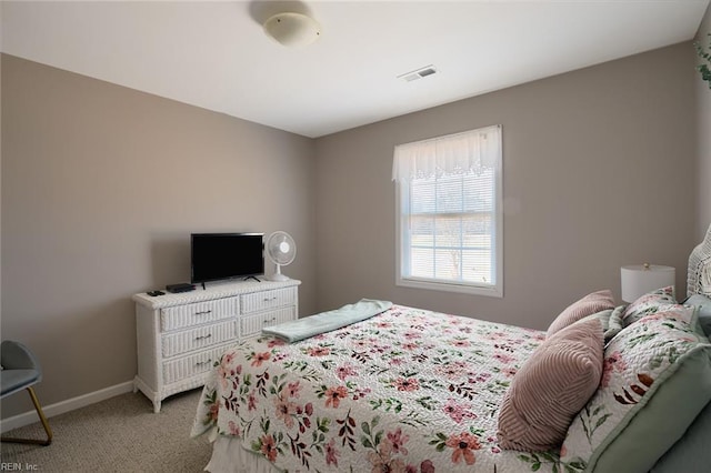 bedroom with light colored carpet