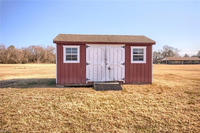 view of outdoor structure with a yard