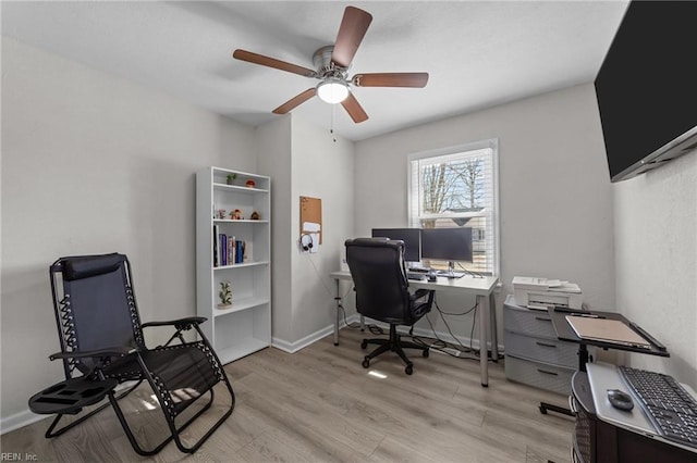 office area with ceiling fan and light hardwood / wood-style flooring