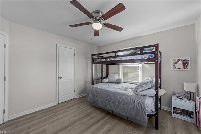 bedroom featuring light hardwood / wood-style flooring and ceiling fan