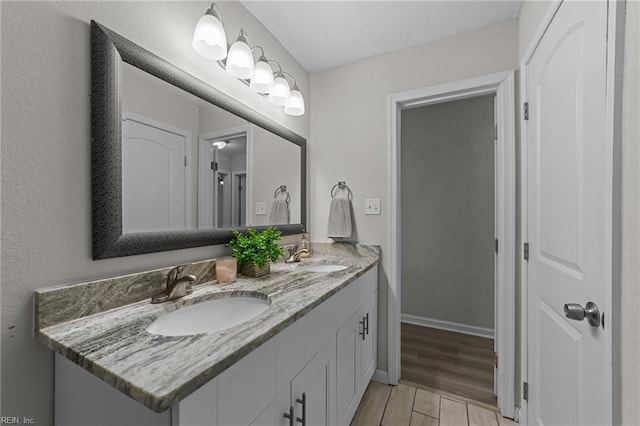 bathroom featuring vanity and hardwood / wood-style floors