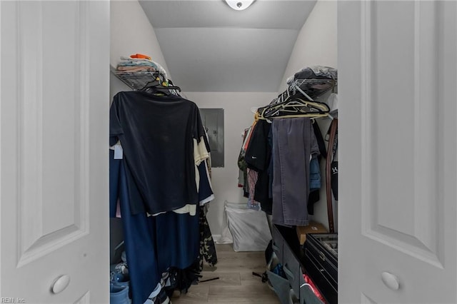 walk in closet featuring lofted ceiling and light hardwood / wood-style floors