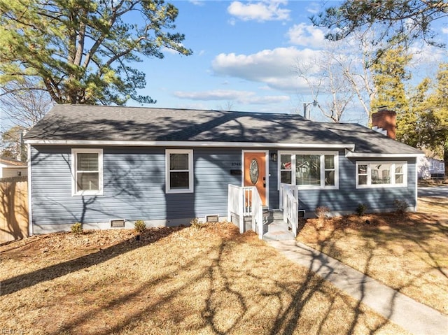 single story home with a front lawn