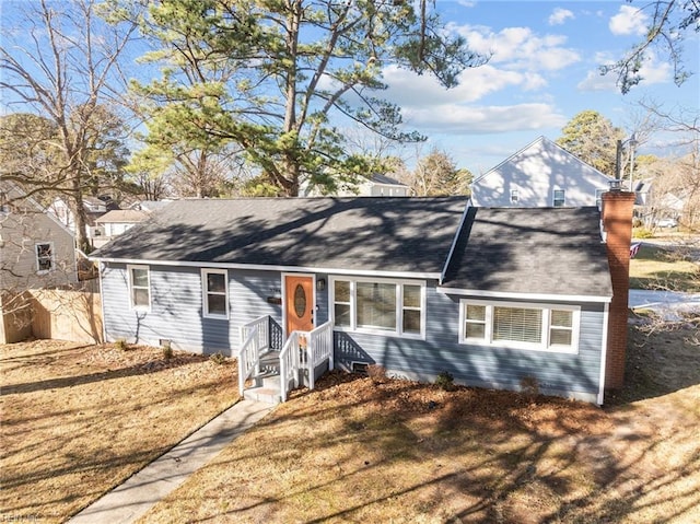 view of front of property with a front lawn