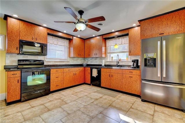 kitchen with sink, backsplash, ceiling fan, and black appliances