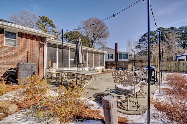 view of patio / terrace featuring a sunroom