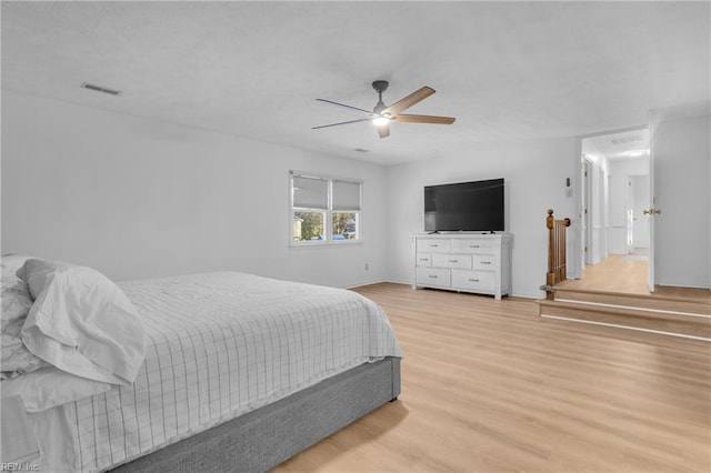 bedroom with ceiling fan and light wood-type flooring