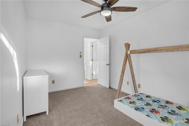 unfurnished bedroom with light colored carpet and ceiling fan