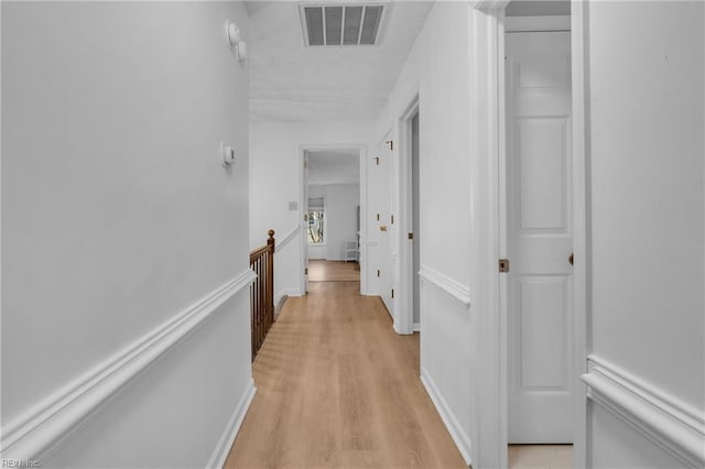 hall with light hardwood / wood-style floors