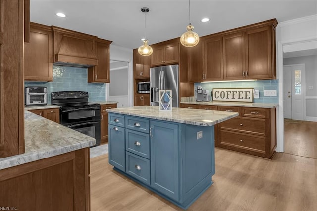 kitchen with appliances with stainless steel finishes, decorative light fixtures, custom exhaust hood, light stone countertops, and a center island with sink