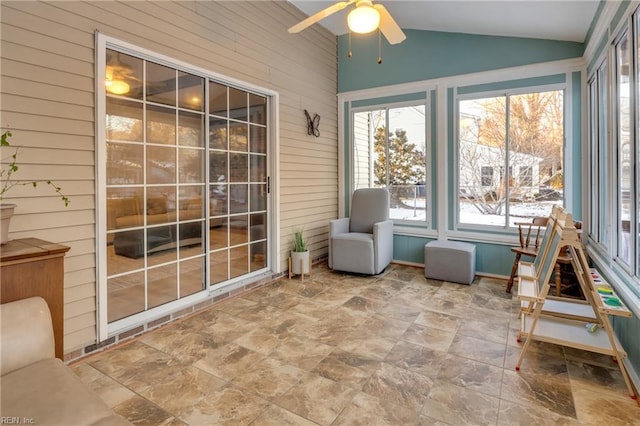 unfurnished sunroom featuring lofted ceiling and ceiling fan